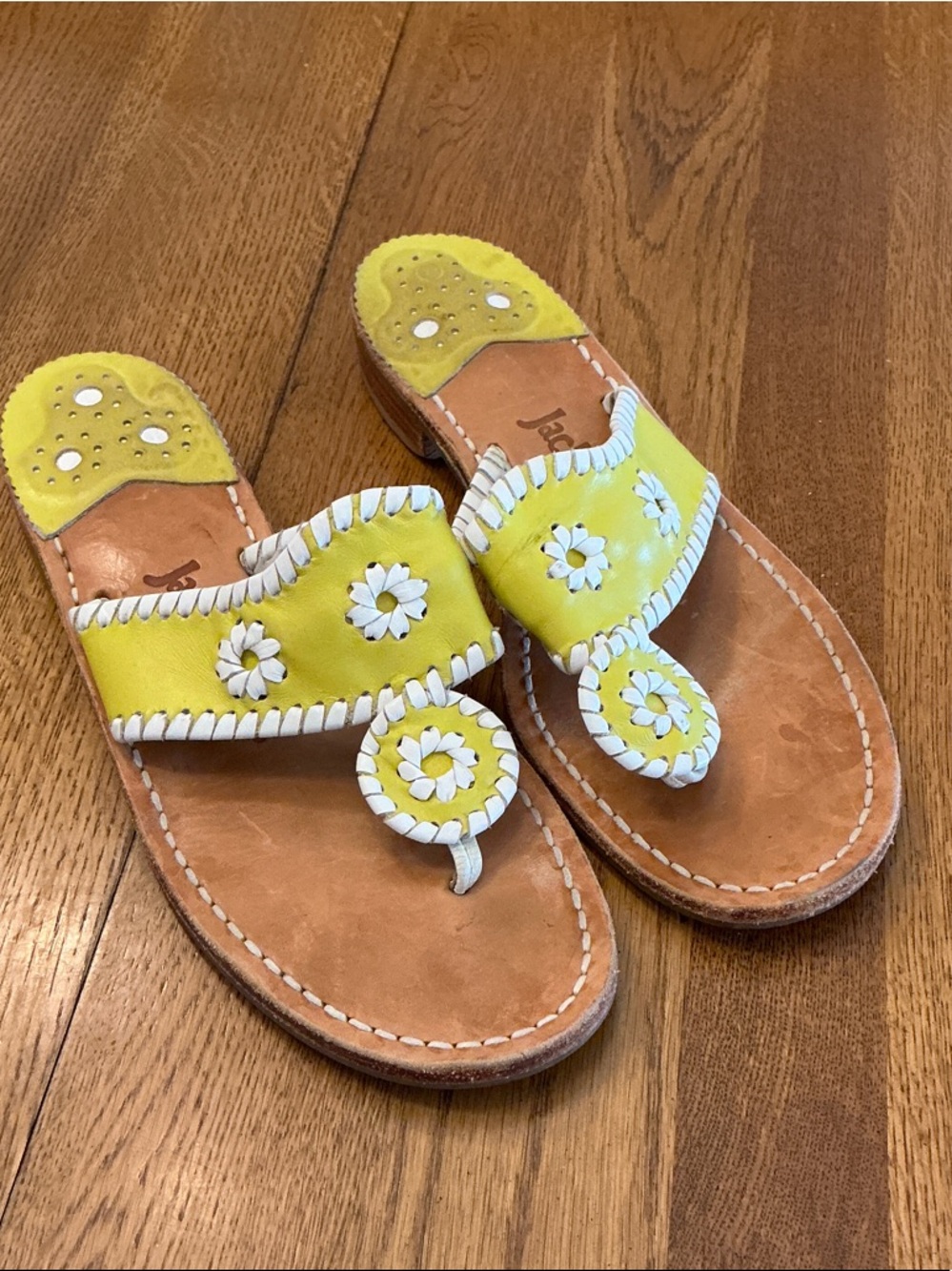 Woman’s Jack Rogers in yellow with white trim. Size 8. Gently worn. Broken in!
